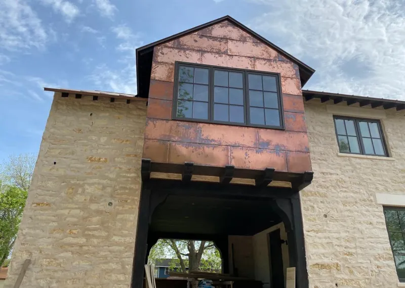 Copper metal panel facade on a stone building for Skylight Installation in Schaumburg