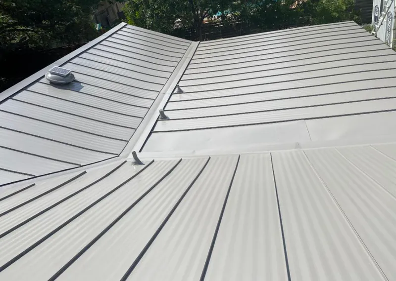 Solar attic fan installed on a metal roof for Roof Ventilation in Schaumburg